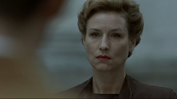 Movie still from “Downfall” (2004), directed by Oliver Hirschbiegel – A person with short hair; Close Up shot, Over the shoulder angle
