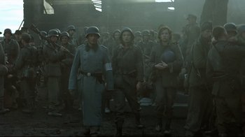 Movie still from “Downfall” (2004), directed by Oliver Hirschbiegel – A group of people dressed in military uniforms; Wide shot, Low angle