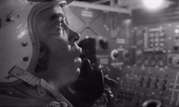 Movie still from “Dr. Strangelove or: How I Learned to Stop Worrying and Love the Bomb” (1964), directed by Stanley Kubrick – An old photo of a man talking on a phone; Close Up shot, Low angle
