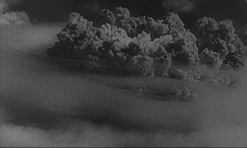 Movie still from “Dr. Strangelove or: How I Learned to Stop Worrying and Love the Bomb” (1964), directed by Stanley Kubrick – A black and white photo of a cloud of smoke; Extreme Wide shot, Overhead angle