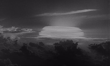 Movie still from “Dr. Strangelove or: How I Learned to Stop Worrying and Love the Bomb” (1964), directed by Stanley Kubrick – A black - and - white photo of a cloudy sky at night; Extreme Wide shot, Low angle