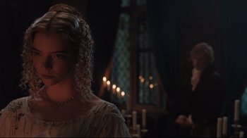 Movie still from “Emma.” (2020), directed by Autumn de Wilde – A woman with curly blonde hair wearing a white dress; Close Up shot, Over the shoulder angle