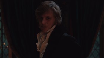 Movie still from “Emma.” (2020), directed by Autumn de Wilde – A man in a black jacket and a white shirt; Close Up shot, Over the shoulder angle