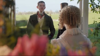 Movie still from “Emma.” (2020), directed by Autumn de Wilde – A man and a woman standing next to each other in a field; Medium shot, Over the shoulder angle