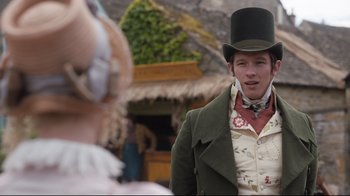 Movie still from “Emma.” (2020), directed by Autumn de Wilde – A man wearing a top hat and a green jacket; Medium shot, Over the shoulder angle