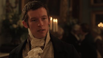 Movie still from “Emma.” (2020), directed by Autumn de Wilde – A man wearing a suit and a neck tie; Close Up shot, Over the shoulder angle