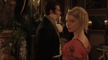 Movie still from “Emma.” (2020), directed by Autumn de Wilde – A man and a woman dressed in period clothing; Medium shot, Over the shoulder angle