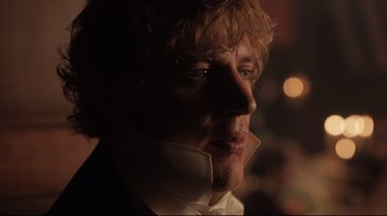 Movie still from “Emma.” (2020), directed by Autumn de Wilde – A person wearing a neck brace; Close Up shot, Over the shoulder angle