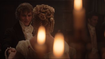 Movie still from “Emma.” (2020), directed by Autumn de Wilde – A man and a woman in period dress looking at each other; Close Up shot, Over the shoulder angle