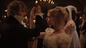 Movie still from “Emma.” (2020), directed by Autumn de Wilde – A man and a woman are dancing in a ballroom; Close Up shot, Low angle