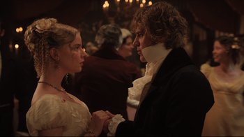 Movie still from “Emma.” (2020), directed by Autumn de Wilde – A man and a woman dressed in period clothing; Close Up shot, Over the shoulder angle