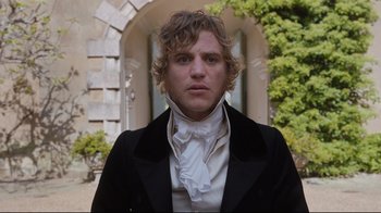 Movie still from “Emma.” (2020), directed by Autumn de Wilde – A man wearing a black jacket and a white neck tie; Medium shot, Over the shoulder angle