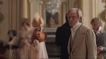Movie still from “Emma.” (2020), directed by Autumn de Wilde – A wax figure of a man in a period costume; Medium shot, Over the shoulder angle