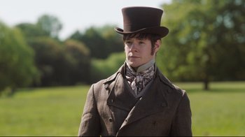 Movie still from “Emma.” (2020), directed by Autumn de Wilde – A man wearing a top hat and a suit; Medium shot, Low angle
