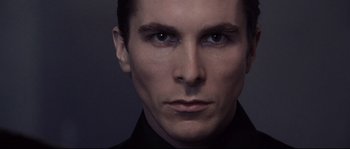 Movie still from “Equilibrium” (2002), directed by Kurt Wimmer – A person wearing a black shirt; Close Up shot, Low angle