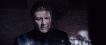 Movie still from “Equilibrium” (2002), directed by Kurt Wimmer – A person wearing a jacket; Close Up shot, Over the shoulder angle