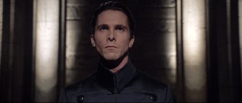 Movie still from “Equilibrium” (2002), directed by Kurt Wimmer – A person wearing a jacket; Close Up shot, Low angle