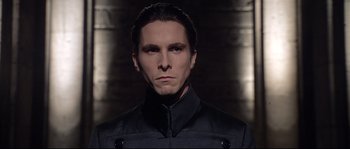 Movie still from “Equilibrium” (2002), directed by Kurt Wimmer – A person wearing a black jacket; Close Up shot, Low angle