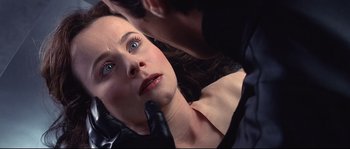 Movie still from “Equilibrium” (2002), directed by Kurt Wimmer – A woman getting her face waxed by a man; Close Up shot, Over the shoulder angle