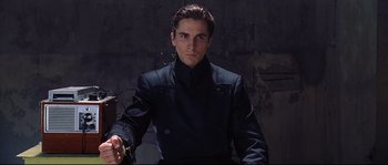 Movie still from “Equilibrium” (2002), directed by Kurt Wimmer – A man wearing a black jacket; Medium shot, Low angle