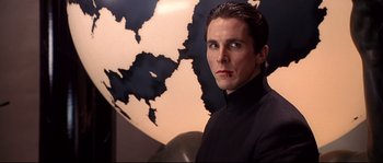 Movie still from “Equilibrium” (2002), directed by Kurt Wimmer – A person wearing a suit; Close Up shot, Low angle