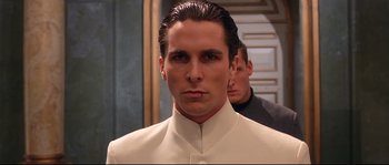 Movie still from “Equilibrium” (2002), directed by Kurt Wimmer – A man in a white shirt and a man in a black shirt; Close Up shot, Low angle