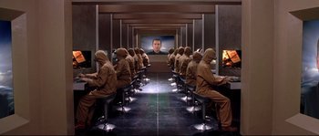 Movie still from “Equilibrium” (2002), directed by Kurt Wimmer – A group of people sitting in front of computer monitors; Wide shot, High angle