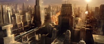 Movie still from “Equilibrium” (2002), directed by Kurt Wimmer – An image of a city with a fire coming out of it; Extreme Wide shot, Overhead angle