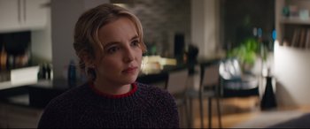 Movie still from “Free Guy” (2021), directed by Shawn Levy – A young woman is sitting in front of a table; Close Up shot, Over the shoulder angle