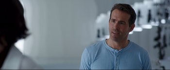 Movie still from “Free Guy” (2021), directed by Shawn Levy – A person wearing a blue shirt; Close Up shot, Over the shoulder angle