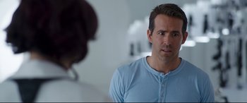 Movie still from “Free Guy” (2021), directed by Shawn Levy – A person wearing a blue shirt; Close Up shot, Over the shoulder angle