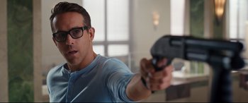 Movie still from “Free Guy” (2021), directed by Shawn Levy – A man holding a video game controller in his hand; Close Up shot, Over the shoulder angle