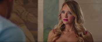 Movie still from “Free Guy” (2021), directed by Shawn Levy – A woman with long blonde hair wearing a pink top; Close Up shot, Over the shoulder angle