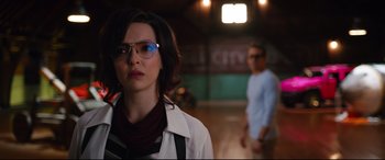Movie still from “Free Guy” (2021), directed by Shawn Levy – A woman wearing glasses standing next to a man; Medium shot, Over the shoulder angle