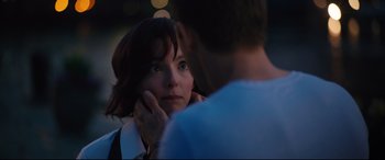 Movie still from “Free Guy” (2021), directed by Shawn Levy – A woman looking at a man with his hand on her chin; Close Up shot, Over the shoulder angle
