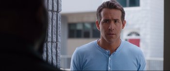 Movie still from “Free Guy” (2021), directed by Shawn Levy – A person wearing a blue shirt; Close Up shot, Over the shoulder angle