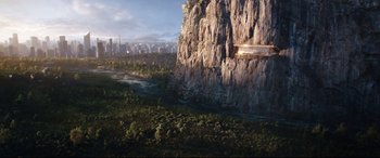 Movie still from “Free Guy” (2021), directed by Shawn Levy – An aerial view of a mountain and a river; Extreme Wide shot, Overhead angle