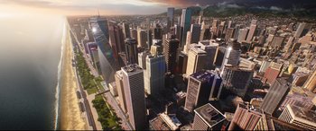 Movie still from “Free Guy” (2021), directed by Shawn Levy – An aerial view of a large city with skyscrapers; Extreme Wide shot, High angle