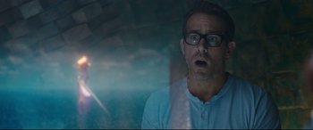 Movie still from “Free Guy” (2021), directed by Shawn Levy – A man with glasses is looking out of a window; Close Up shot, Over the shoulder angle