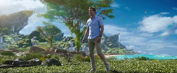 Movie still from “Free Guy” (2021), directed by Shawn Levy – A man walking in the grass near a waterfall; Wide shot, Low angle