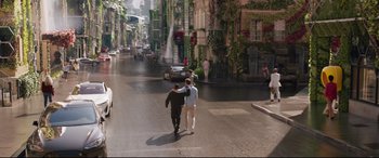 Movie still from “Free Guy” (2021), directed by Shawn Levy – Two men walking down a street holding hands; Wide shot, Over the shoulder angle