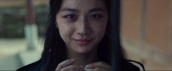 Movie still from “Decision to Leave” (2022), directed by Park Chan-wook – A woman's face in front of a mirror; Close Up shot, Over the shoulder angle