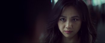 Movie still from “Decision to Leave” (2022), directed by Park Chan-wook – A person with long hair; Close Up shot, Over the shoulder angle