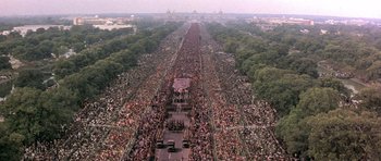 Movie still from “Gandhi” (1982), directed by Richard Attenborough – An aerial view of a large crowd of people on a street; Extreme Wide shot, High angle