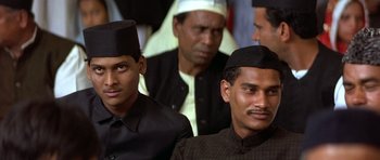 Movie still from “Gandhi” (1982), directed by Richard Attenborough – A group of men standing next to each other; Close Up shot, High angle