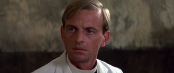 Movie still from “Gandhi” (1982), directed by Richard Attenborough – A person wearing a white shirt; Close Up shot, Low angle