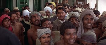 Movie still from “Gandhi” (1982), directed by Richard Attenborough – A large group of men standing next to each other; Medium shot, High angle