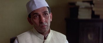 Movie still from “Gandhi” (1982), directed by Richard Attenborough – A person wearing a hat; Close Up shot, Low angle