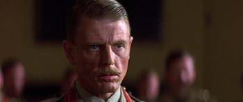 Movie still from “Gandhi” (1982), directed by Richard Attenborough – A person with a mustache; Close Up shot, Low angle