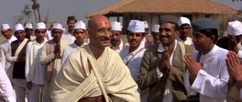 Movie still from “Gandhi” (1982), directed by Richard Attenborough – A group of men standing next to each other; Medium shot, Low angle